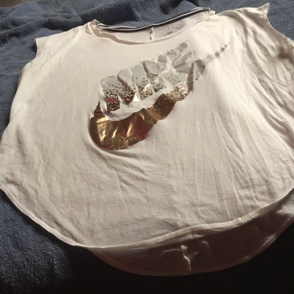 silver and gold nike shirt